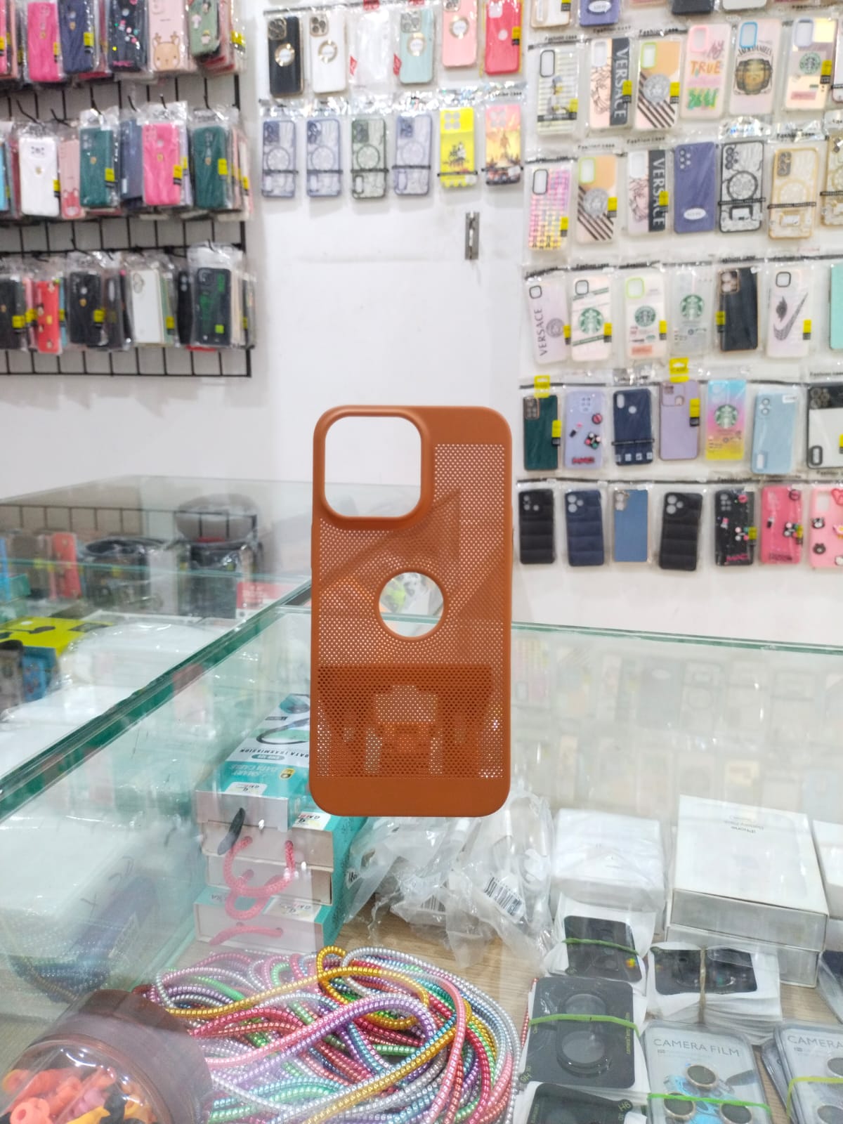 Perforated Elegance: Premium Orange iPhone 14 Pro Max Cover