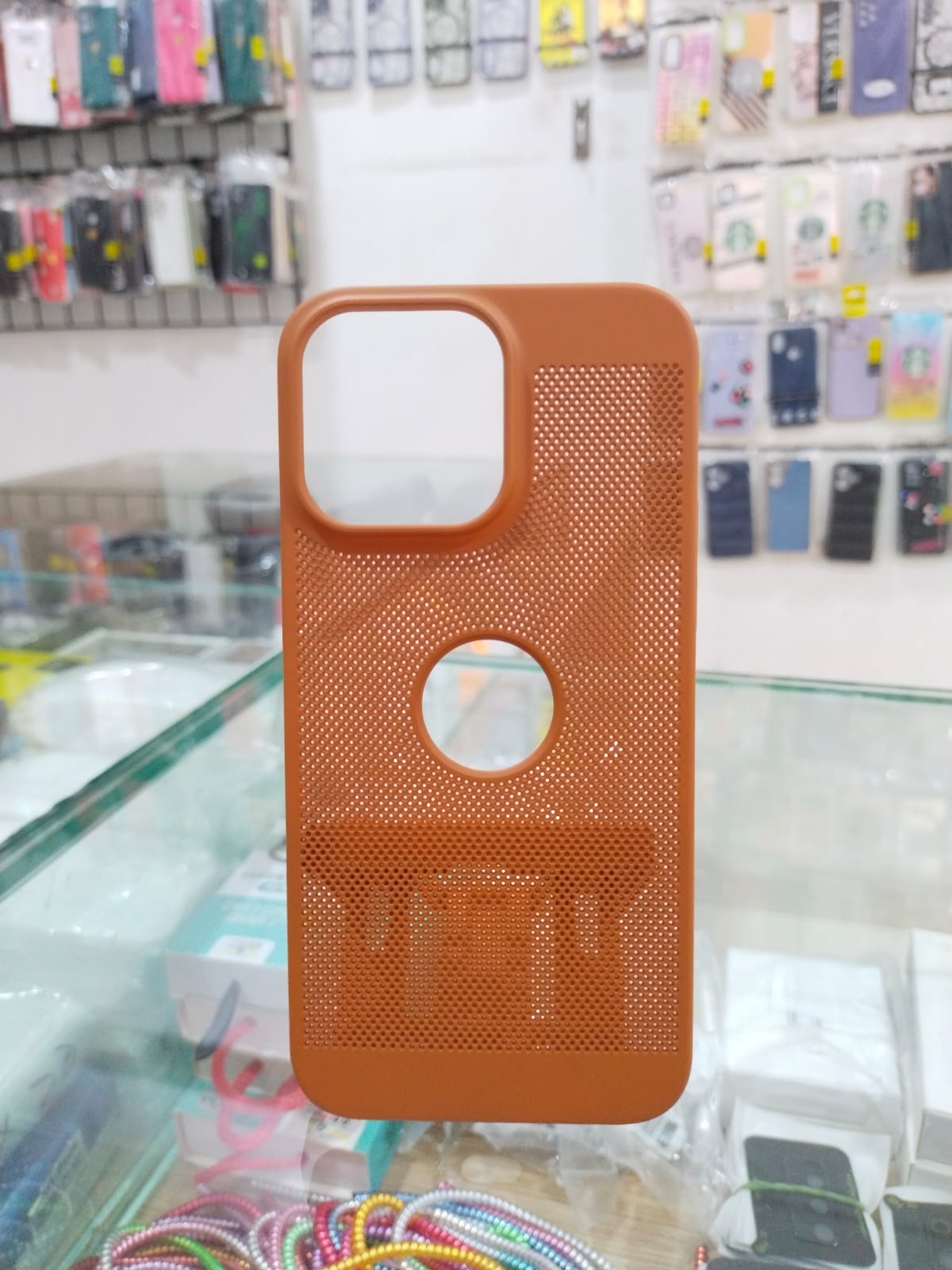 Perforated Elegance: Premium Orange iPhone 14 Pro Max Cover